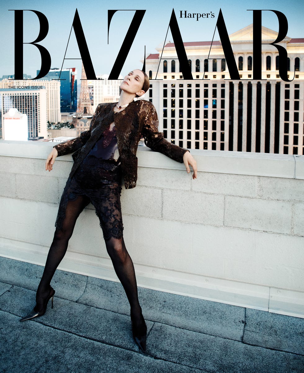 A model in a stylish outfit poses against a city skyline backdrop for the cover of Harper's Bazaar. A model in a stylish outfit poses against a city skyline backdrop for the cover of Harper's Bazaar.