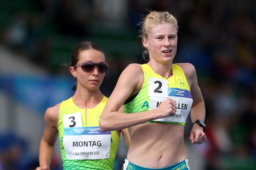 Jemima Montag behind Lizzy McMillen in the women's 10,000m race walk at the Commonwealth Games.