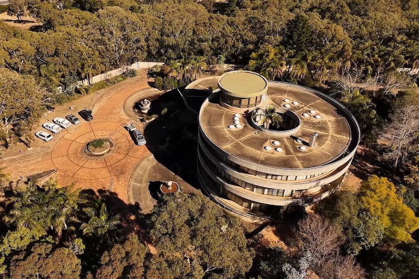 Circular buildings on bushy property from above