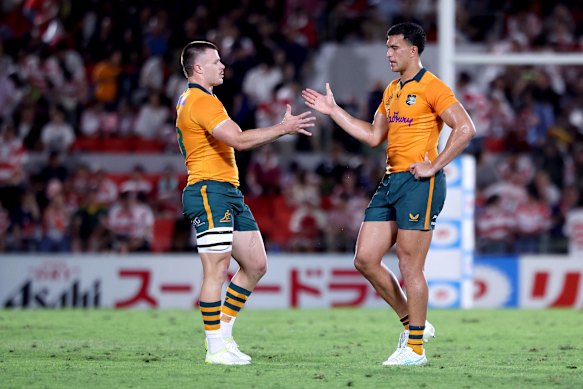 Isaac Henry and Joseph-Aukuso Suaalii celebrate a tough win against Japan. Henry starts ahead of Suaalii.