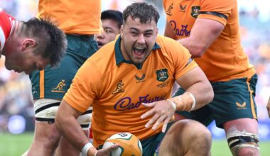 Australia's Massimo De Lutiis celebrates after becoming the 1,000th player capped by the Wallabies with a try on debut