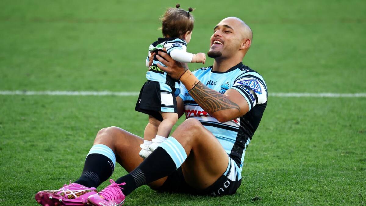 Hohepa Puru enjoyed some time after the hooter with one of his youngest fans. (AAP PHOTOS)