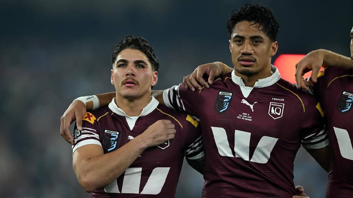 Murray Taulagi (right) has also been a part of the Queensland Maroons Origin squad.  (James Ross/AAP PHOTOS)