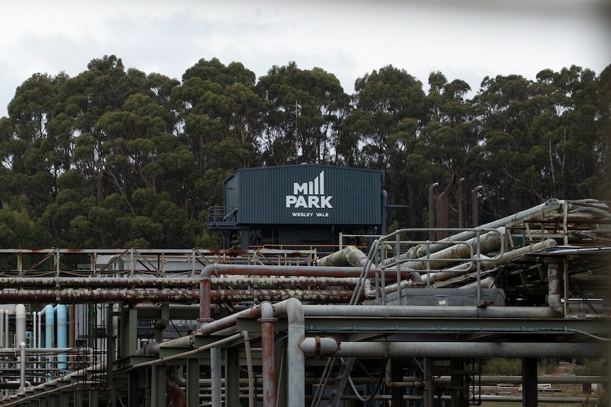 "Mill Park" logo on large steel structure, towering over industrial site