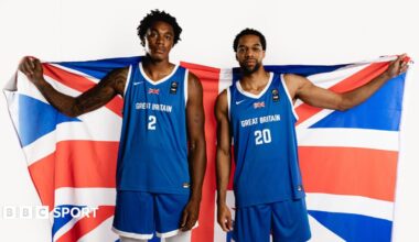 Amari Williams and Tosan Evbuomwan holding up a Great Britain flag while in Great Britain jerseys