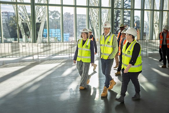 Premier Chris Minns, with Parramatta MP Donna Davis (left) and Powerhouse museum chief executive Lisa Havilah (right), tours the museum in 2025.
