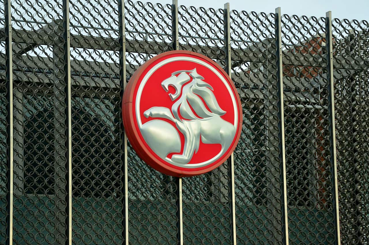 Red and silver Holden logo at the gate of the Holden plant.