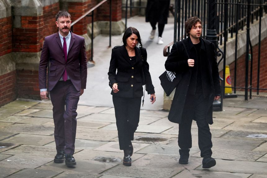 Actress Sadie Frost arrives with her son and barrister at the High Court to testify in the lawsuit.