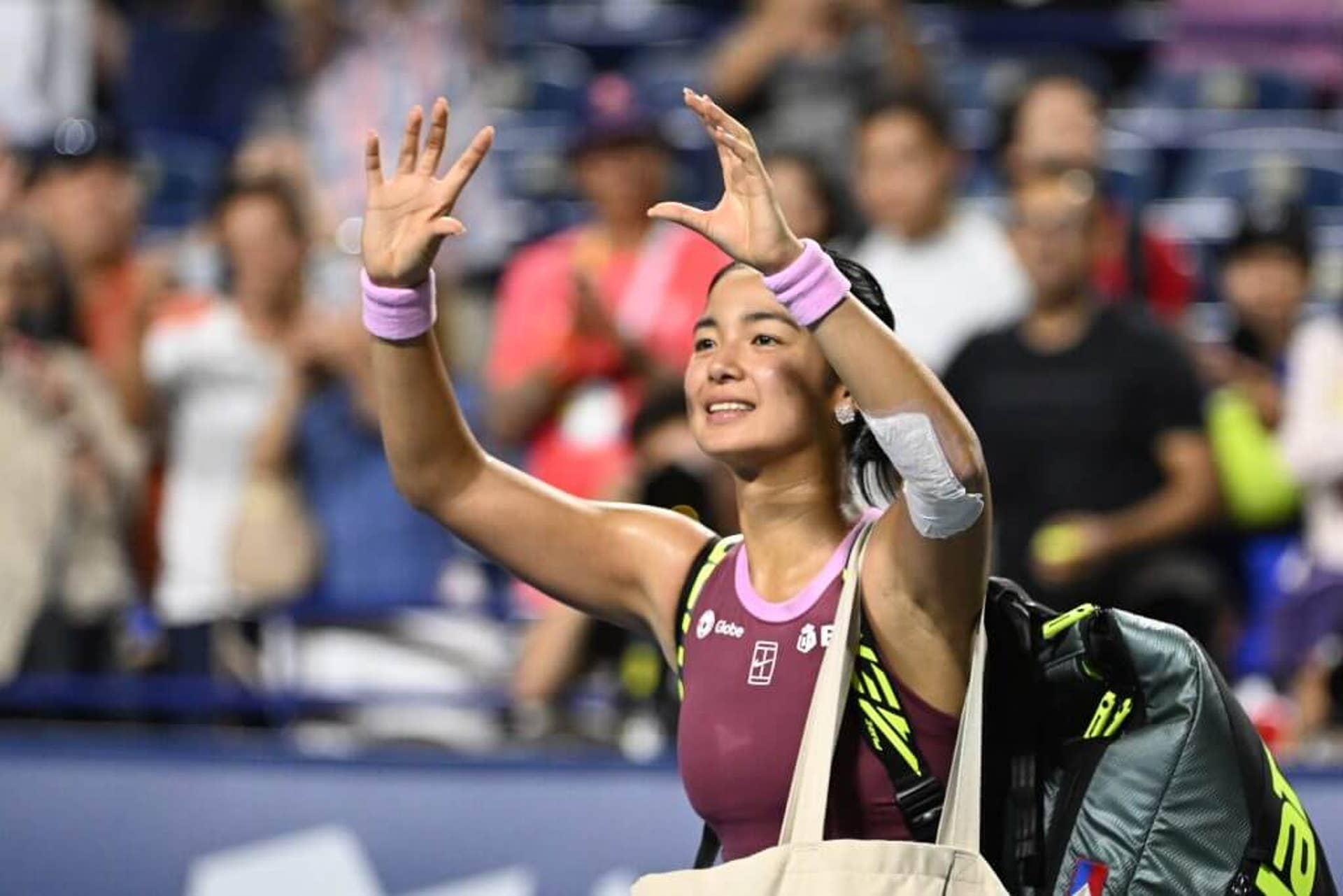 Alexandra Eala waves to the crowd after being eliminated in the fourth round of the Canadian Open.