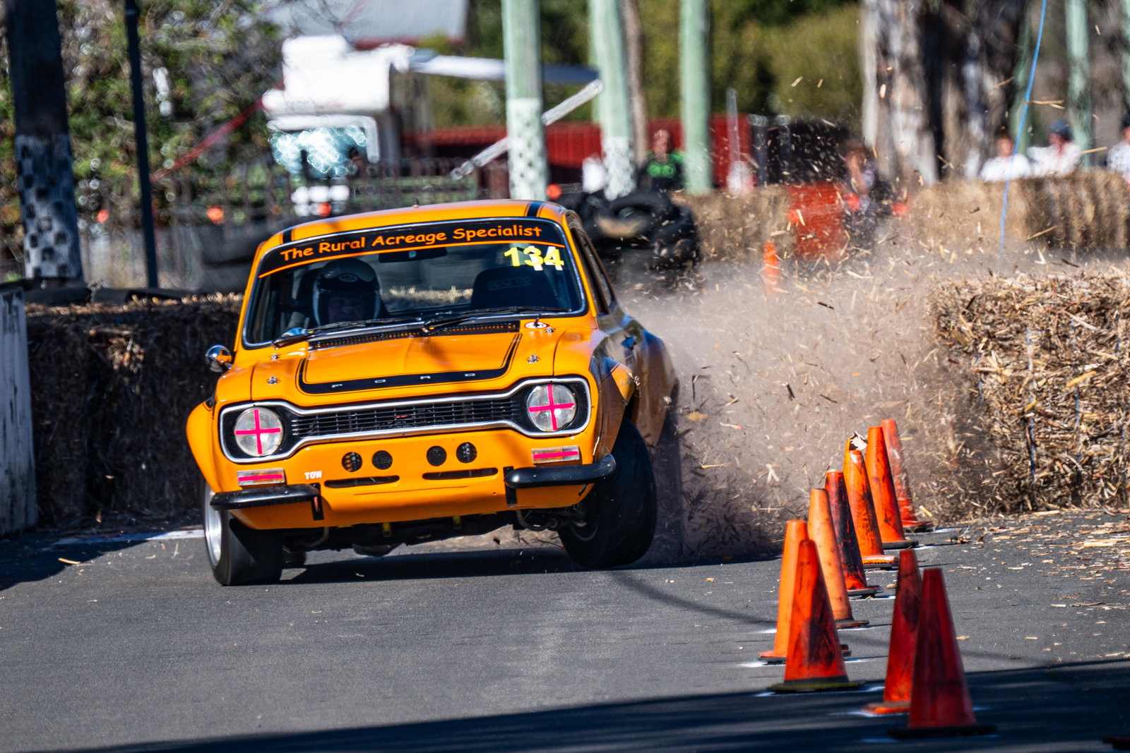 A Ford Escort hits a hay bale during the Historic Leyburn Sprints.