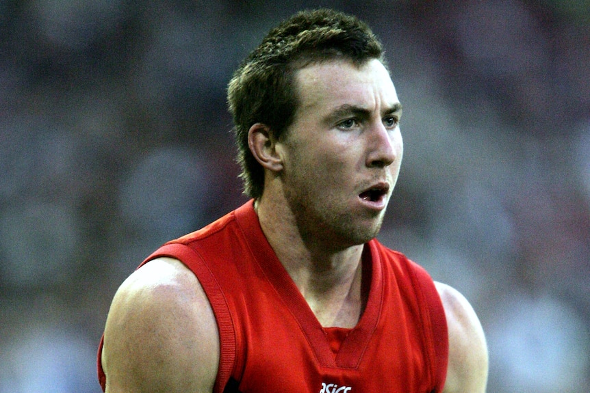 Brock McLean holds the ball