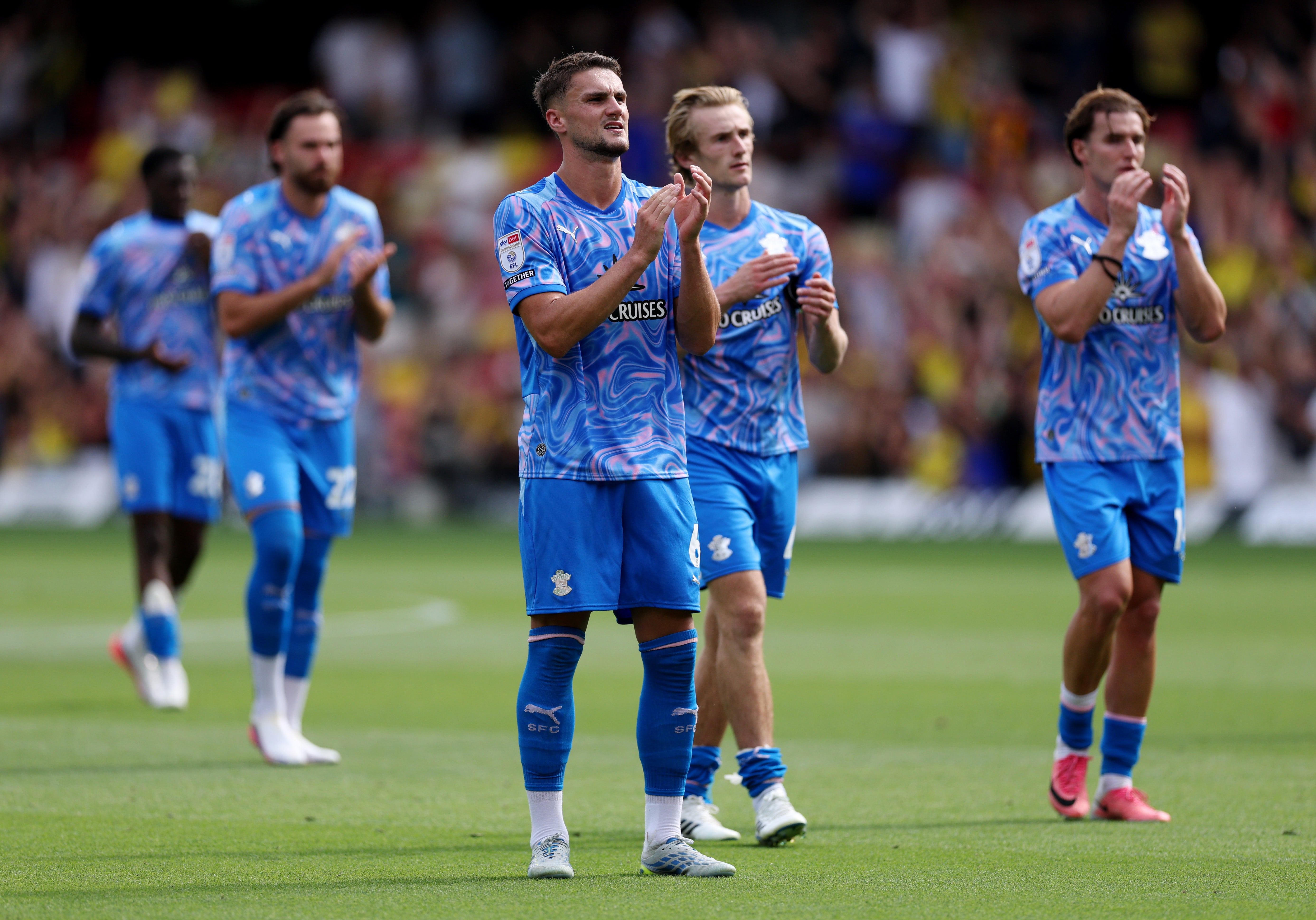 Taylor Harwood-Bellis of Southampton applauds the fans