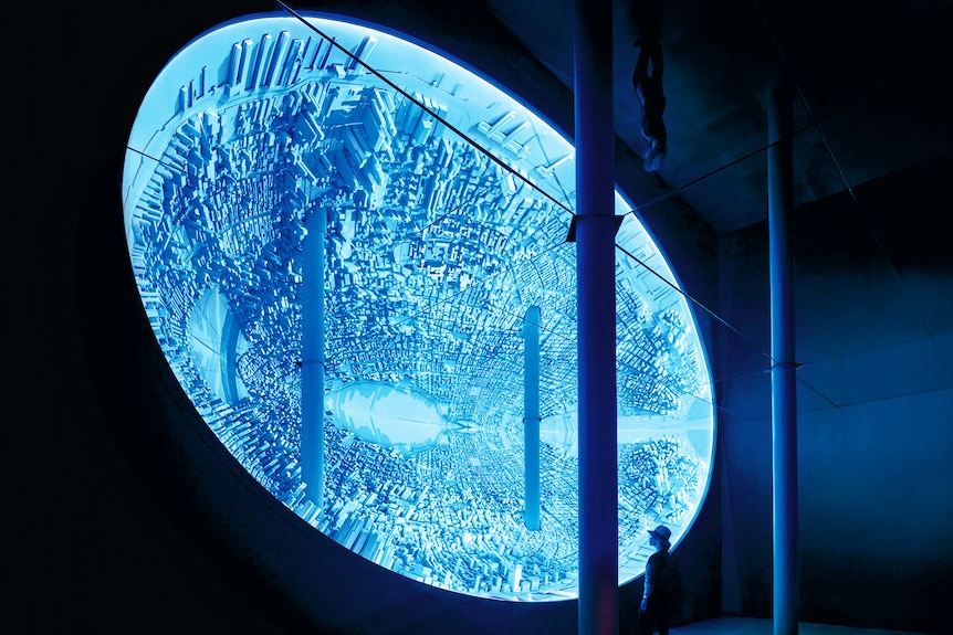 An artwork titled Memory Palace shows a deep blue crater lined with miniature buildings