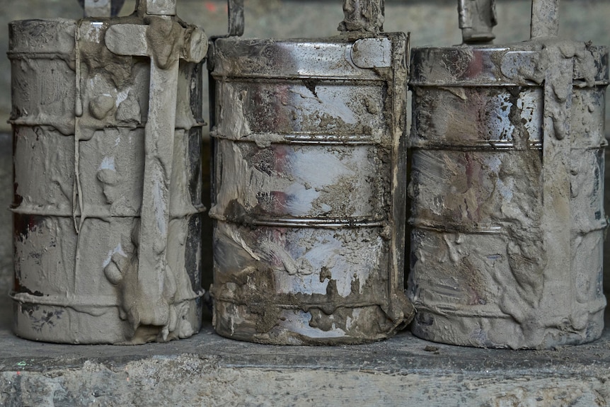 tiffin lunch boxes covered in mud