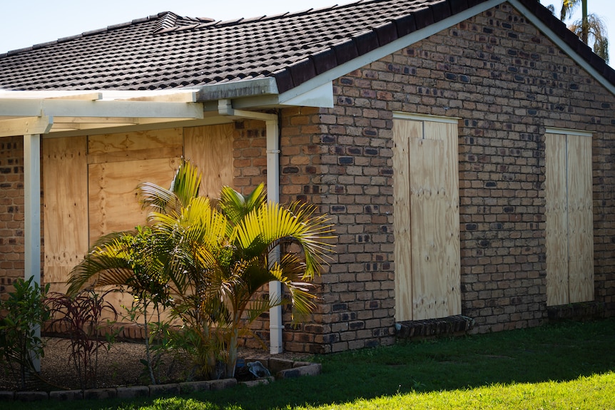 house with boarded windows