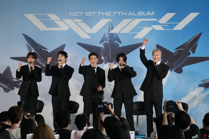 Members of K-pop group NCT 127 pose during a press conference to introduce their new album 'BLINGY' in Seoul, Monday. AP-Yonhap