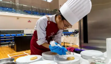 Higher Nitec hospitality student Nur Iman Sulaiman at a cooking competition in May, in which participants were tasked with coming up with meals that incorporated heart-healthy canned ingredients.