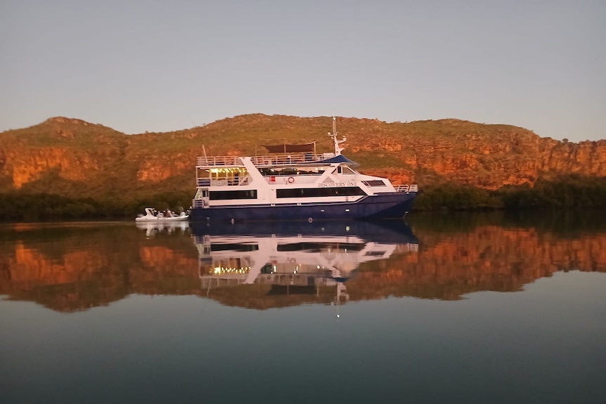 A large boat floats on the water