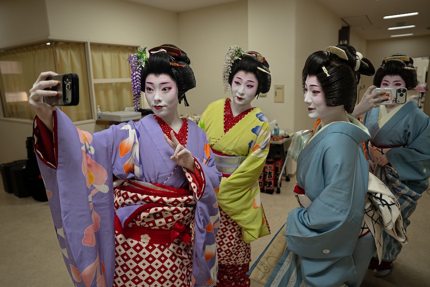 Four women posing for a photo.