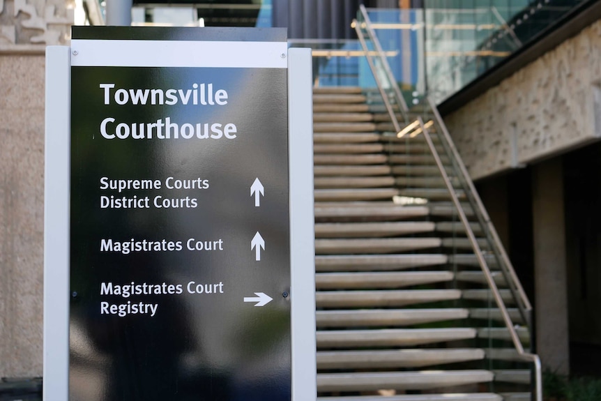Sign in front of a building and stairs says Townsville Courthouse
