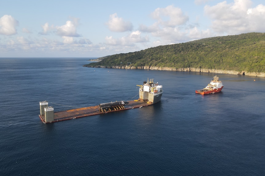 A rocket on a large barge offshore from Christmas Island