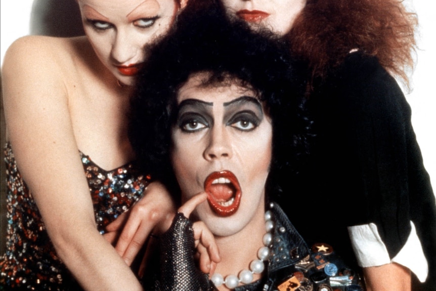 Dr Frank-N-Furter and two of his accomplices posing for a poster photo.