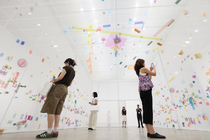 Visitors look around Do Ho Suh's 'Perfect Home: London, Horsham, New York, Berlin, Providence, Seoul' (2024) installed at the National Museum of Modern and Contemporary Art, Korea (MMCA), Seoul, during a preview of the exhibition 'Do Ho Suh,' Wednesday. Yonhap