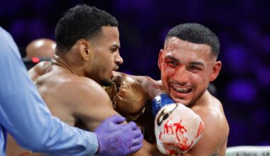 Bloodied star survives scare to outclass rival, complete historic three-division world title feat