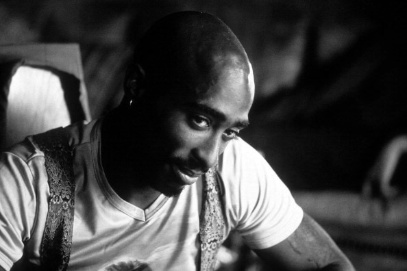 A close up of Tupac's face in black-and-white film.