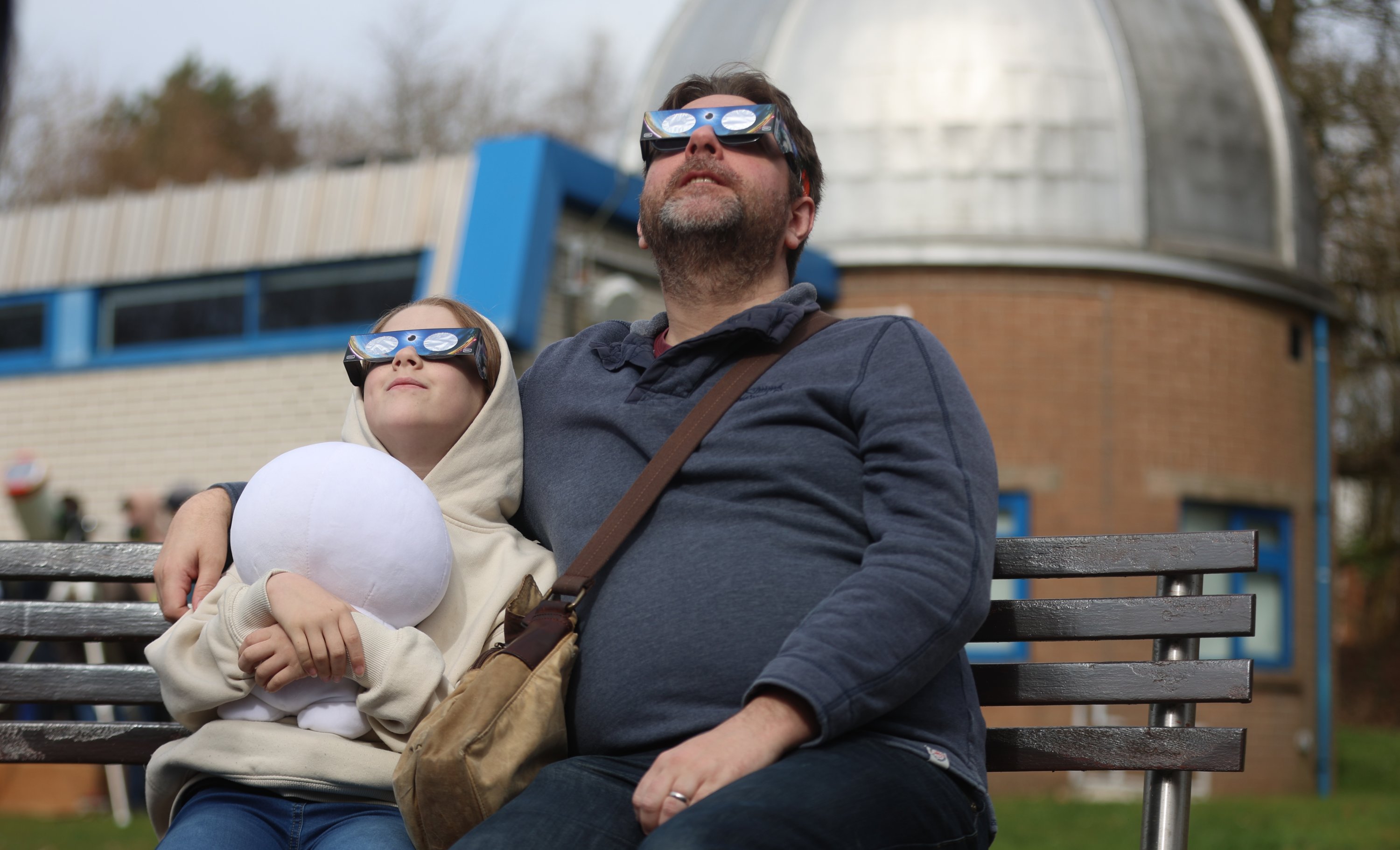 People watch a partial solar eclipse at the Keele Observatory, Keele, Staffordshire, March 29, 2025. (Getty Images Photo)