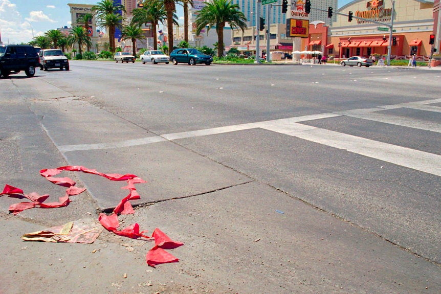 A Hollywood street with a zebra crossing - a red hazard tape lays discarded on the ground