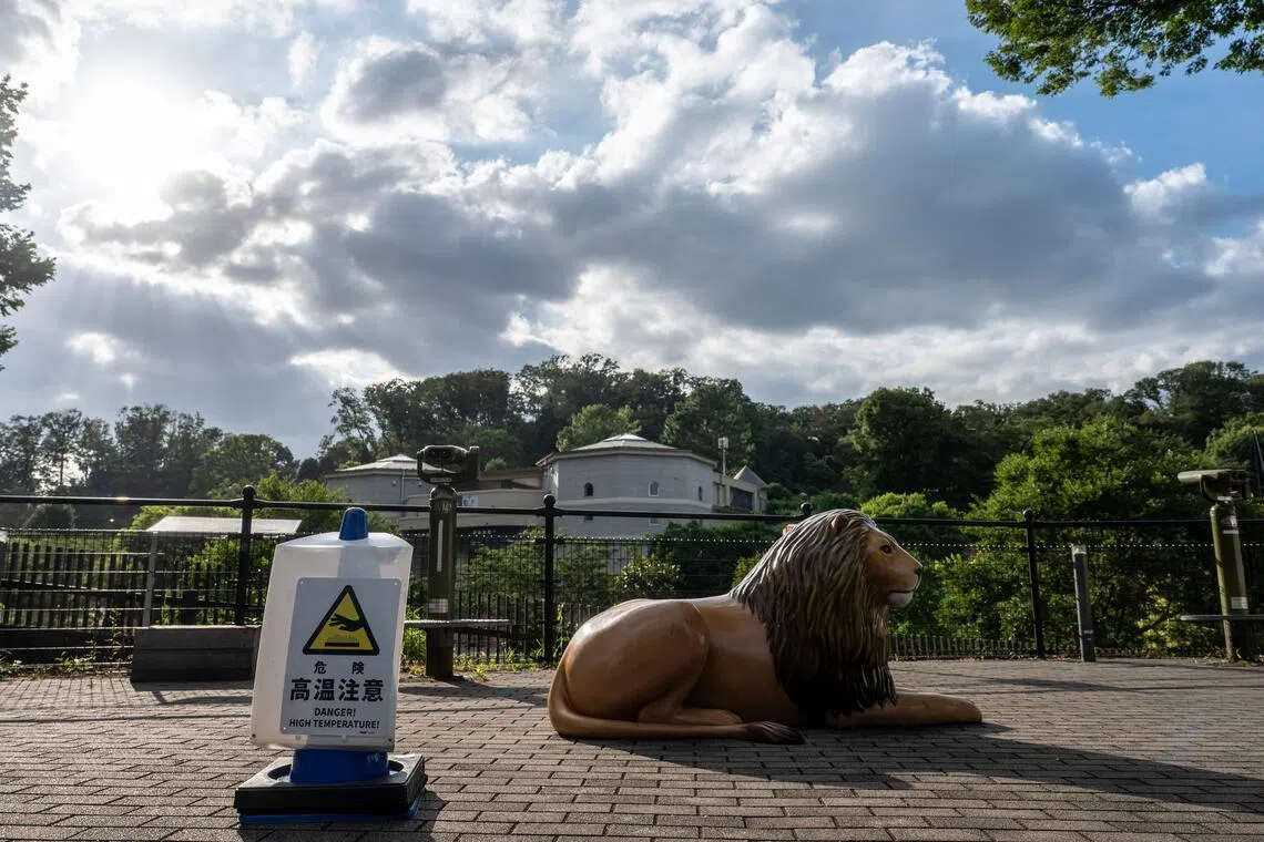 A high temperature warning sign at the Tama Zoological Park in Hino, Japan on Aug 4.