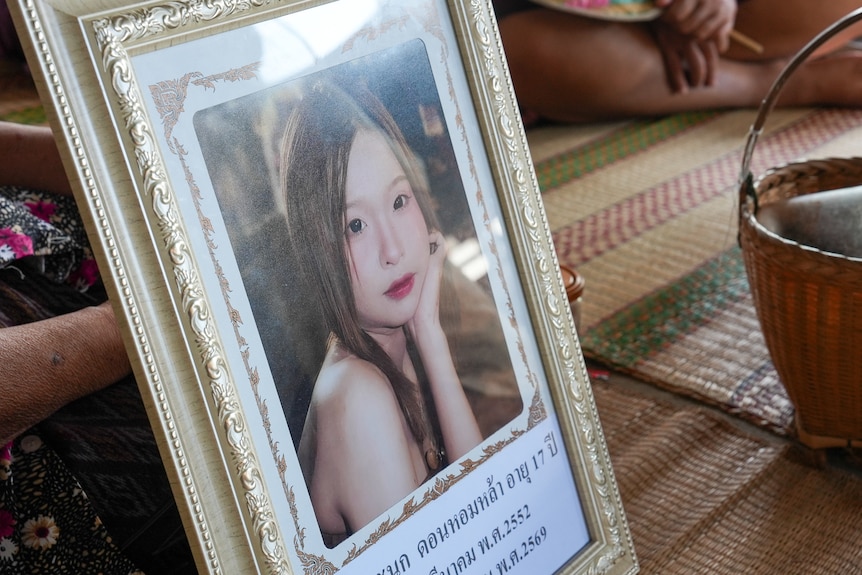 A frame of a young Thai girl looking at the camera.