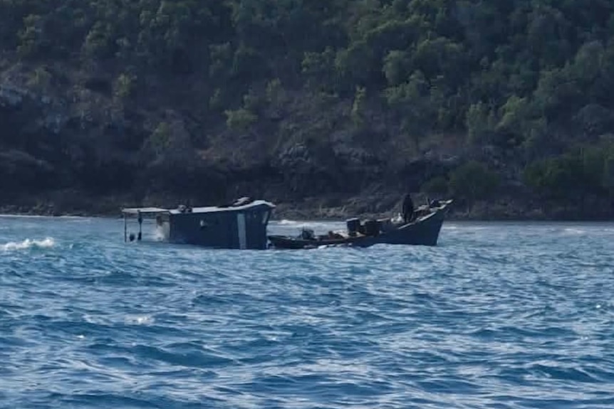 A foreign boat floating on the water.