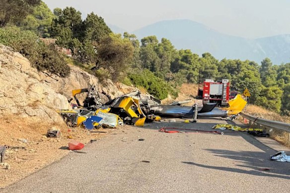 Wreckage of the helicopter lies on a road near Psatha.