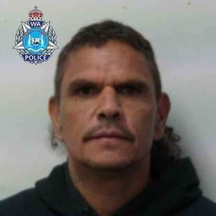 A mugshot of a man wearing a hoodie