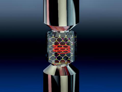 A molecular hexagonal lattice with a red spiral in a clear substance between two metal rods.