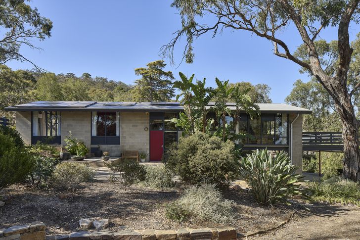 The home’s concrete block form reflects the material scarcity of the time.