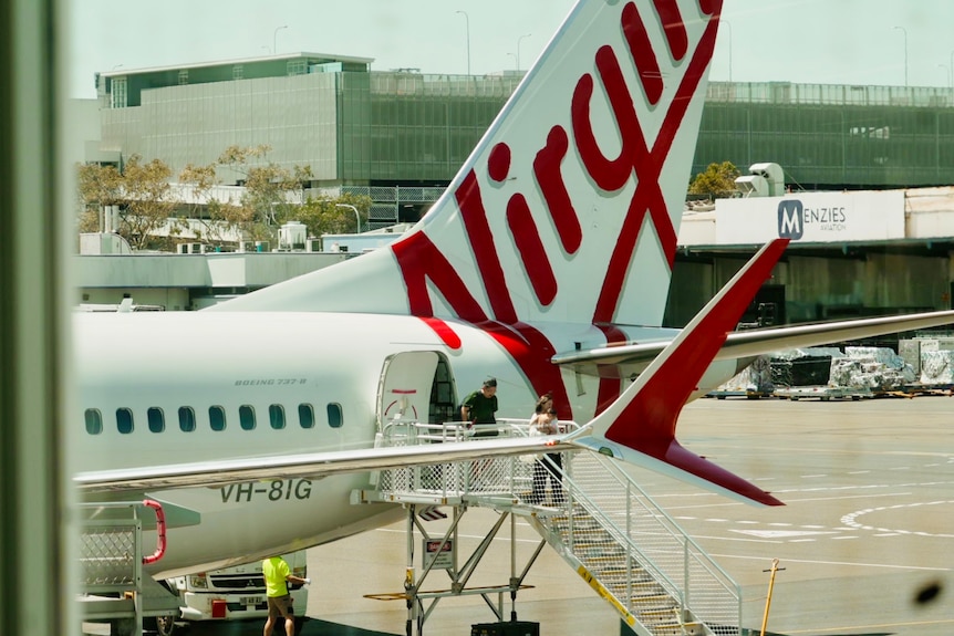 Virgin planes at an airport.