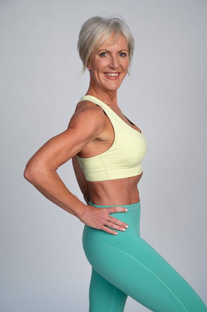 Muscular woman in green and yellow activewear
