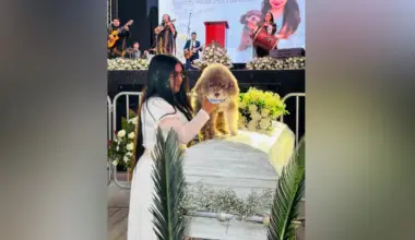 Jessica Florez, the sister-in-law of Colombian lawyer Lenny Ruiz, who died protecting her dog Salomon during the Aug 10 earthquake, with Salomon during Ruiz’s funeral on Aug 13.