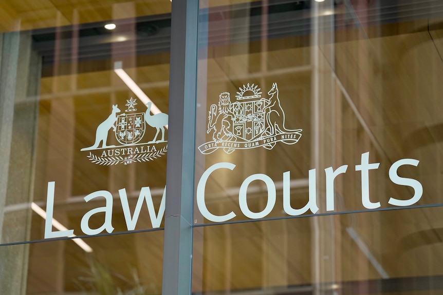 A close up of Law Courts signage on glass.