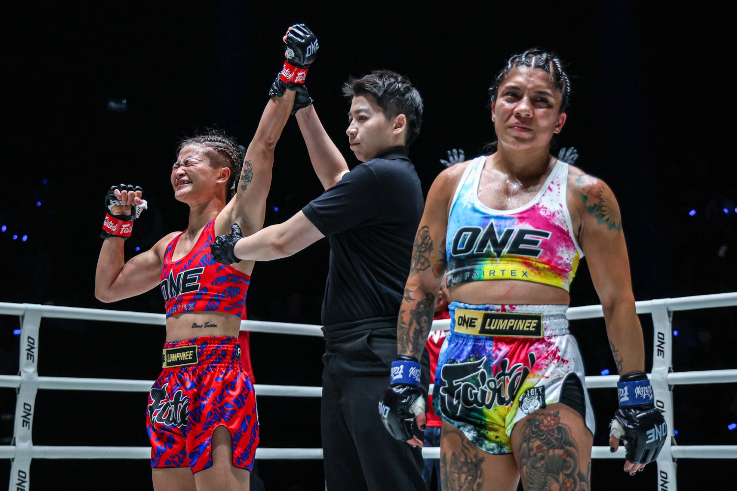 Stamp Fairtex has her hand raised following her split-decision victory over Cynthia Flores at Lumpinee Stadium