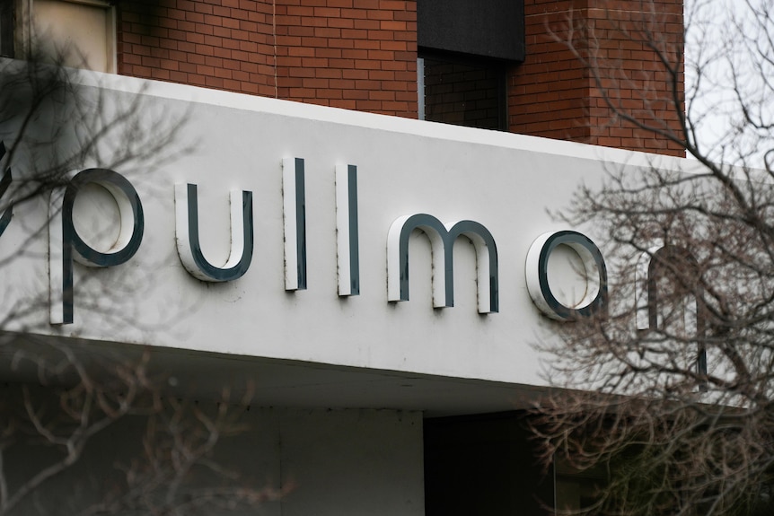 The outside of the Pullman hotel, with a sign visible.
