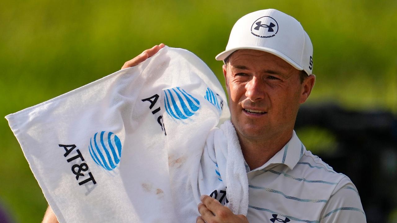 Jordan Spieth uses a towel to wipe his face during the first round of the St. Jude Championship golf tournament Thursday, Aug. 13, 2026, in Memphis, Tenn. (AP Photo/George Walker IV)