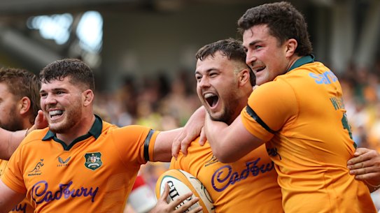 Wallabies and Queensland Reds player Massimo De Lutiis celebrates scoring a try on debut.