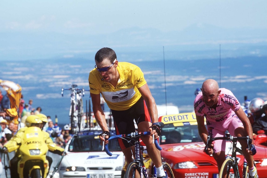 Lance Armstrong leads Marco Pantani up a climb.