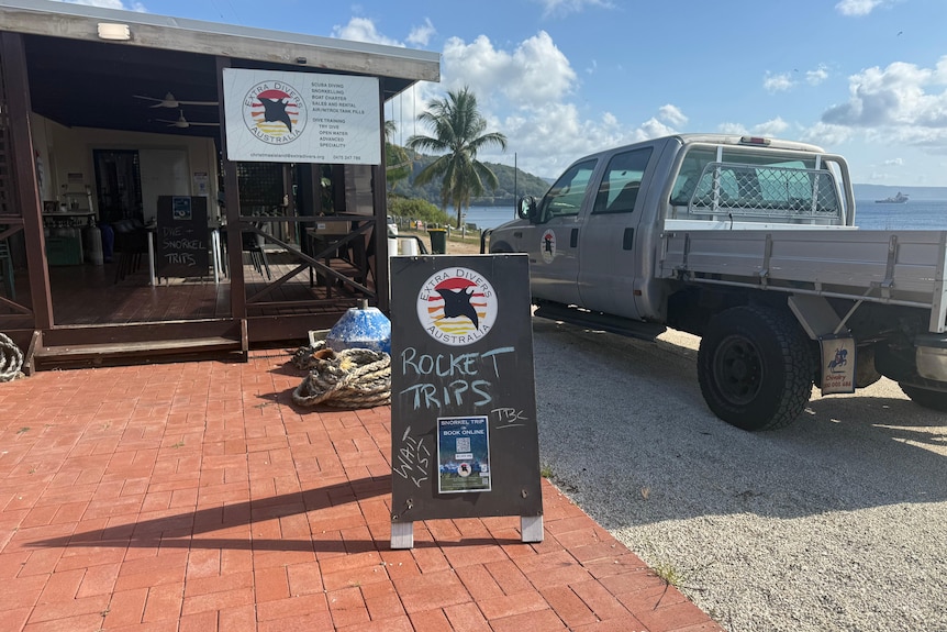 A sign reading: rocket trips