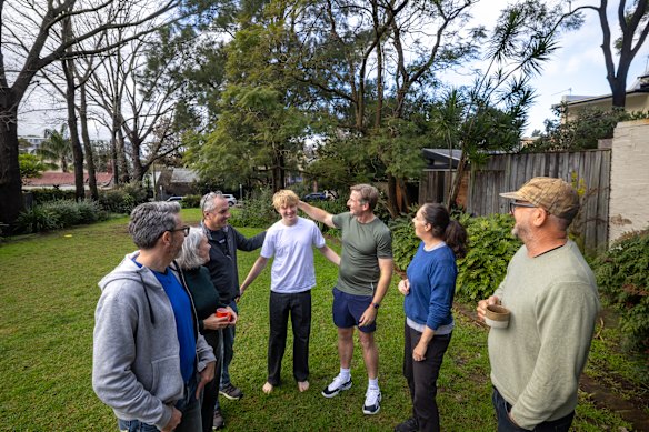 At Erskineville’s Amy Street Reserve, home owners Eric and Melissa Rivers, Lachlan with father Tom Harden, and Julia Corbett and Tim Gordon have homes with gates opening onto the green space.
