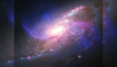 Glowing galaxy with anomalous extra arms photo of the day for Aug. 27, 2026